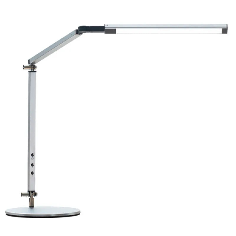 Clip-on aluminium desk lamp with remote control in dazzling black colour, mounted on a desk edge.