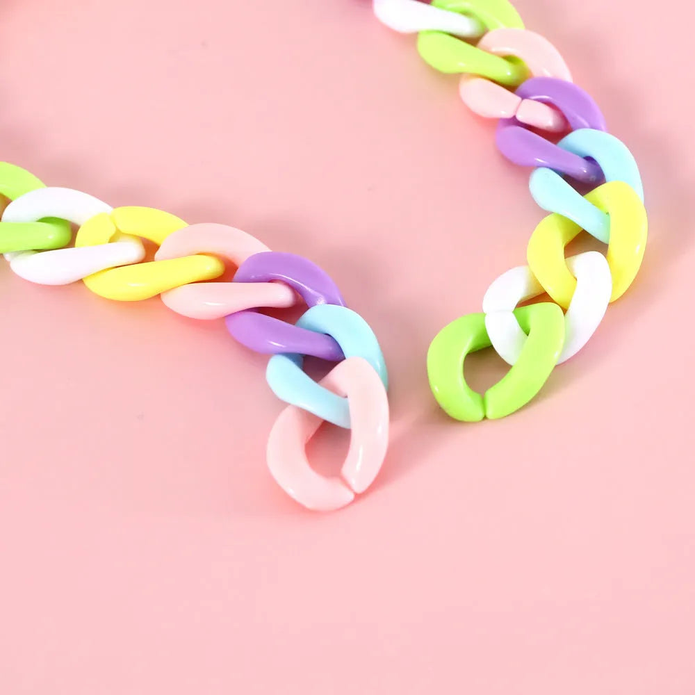 Macaron candy coloured plastic pet collar for cats, dogs, or rabbits on a chain.