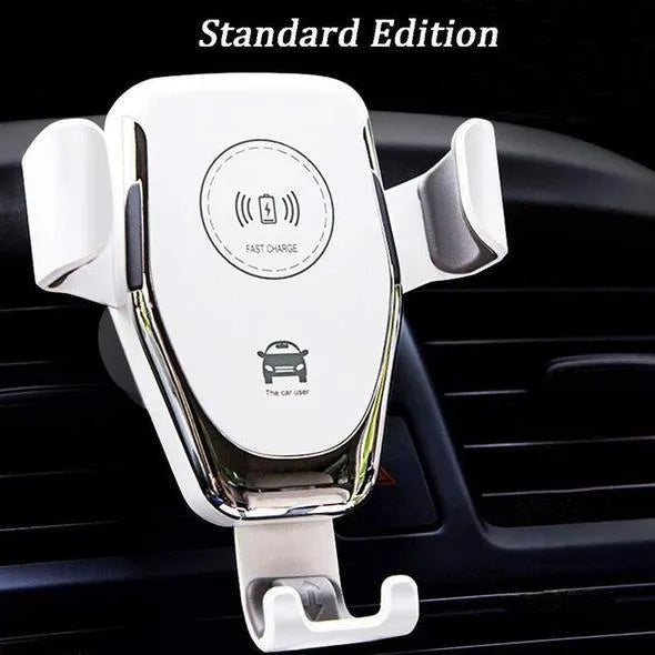 Black wireless car charger mounted on a car vent, holding an iPhone.