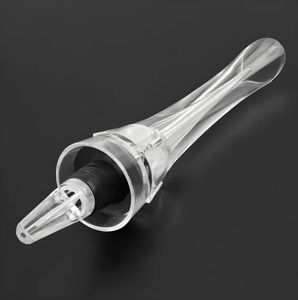 Clear acrylic wine aerator with stainless steel filter measuring 16x4.2cm pouring red wine into a glass