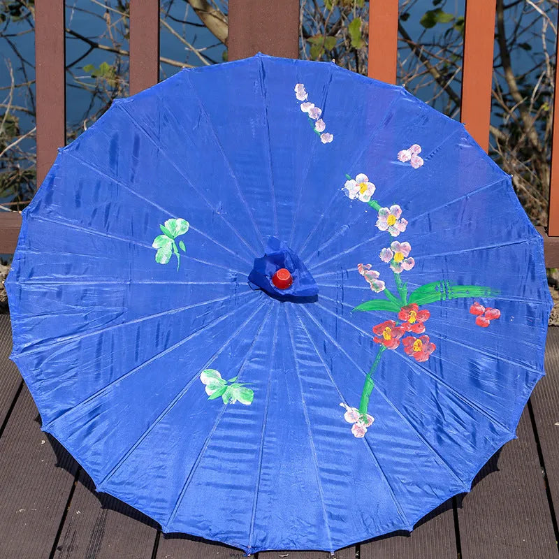 Handmade Chinese-style silk dance umbrella with wooden pole, available in ten colours and four diameters.