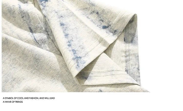 Gray tie dye T-shirt with all-over paint print design, loose fit with short sleeves and round neck