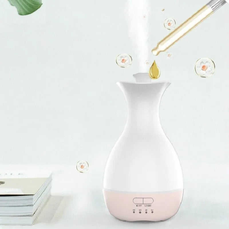 White ultrasonic aromatherapy vase diffuser with colour-changing night light and 200ml water tank capacity.