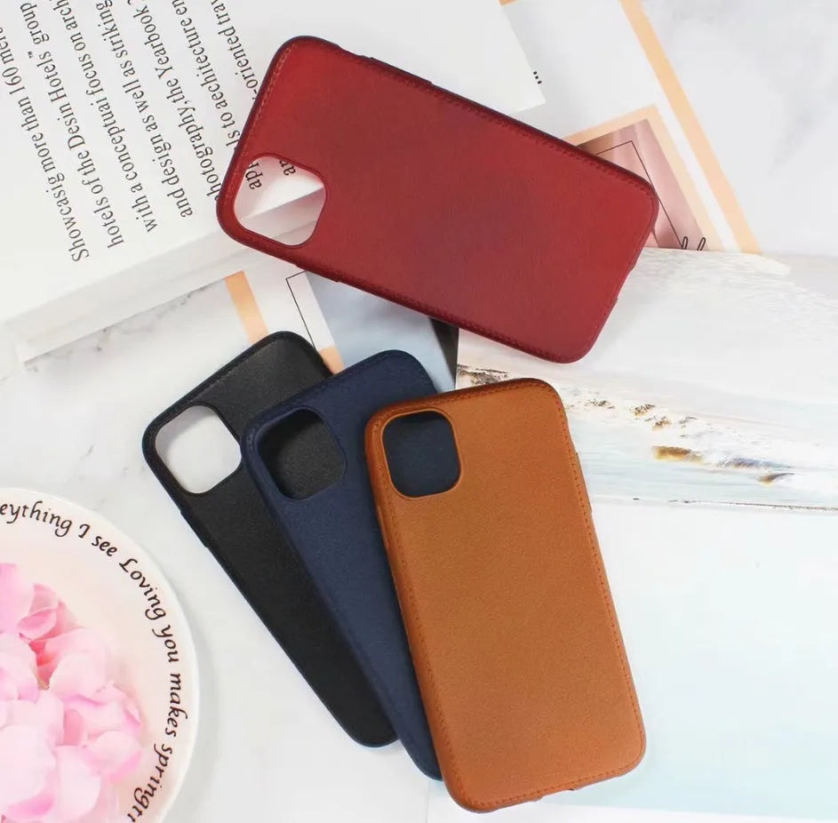 Leather phone case with TPU construction for iPhone, available in black, brown, navy blue and wine red.