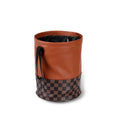 Leather retractable interior car bin with handle, shown in vehicle cabin setting