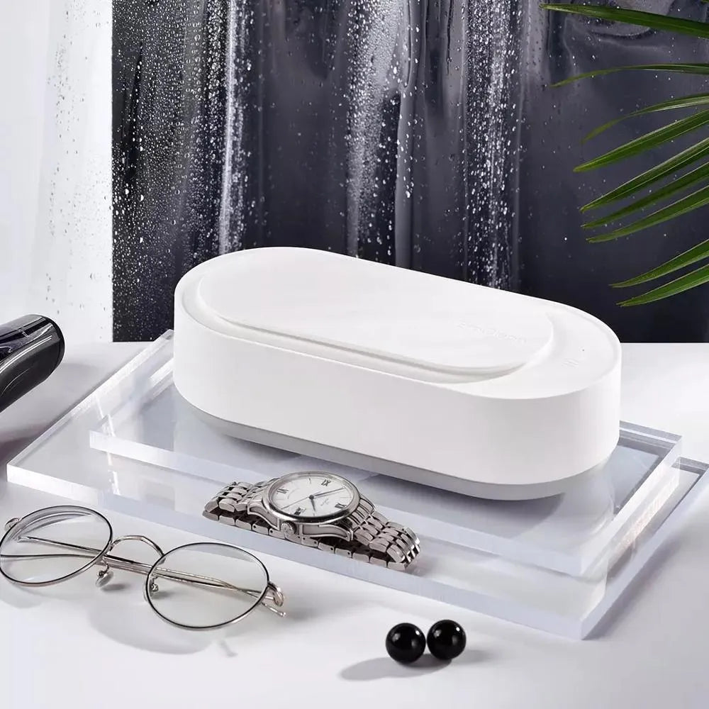 White portable ultrasonic cleaning machine with display and stainless steel tank.