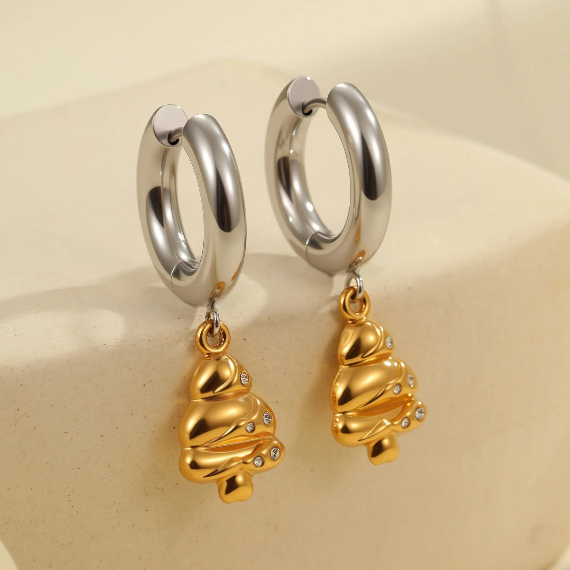 Christmas tree shaped heart earrings with star motifs in gold electroplated stainless steel