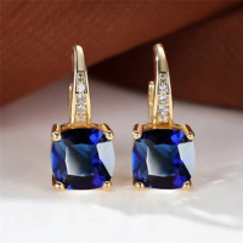 Square geometric copper ear clip earrings with colourful moissanite inlay and electroplated gold finish.