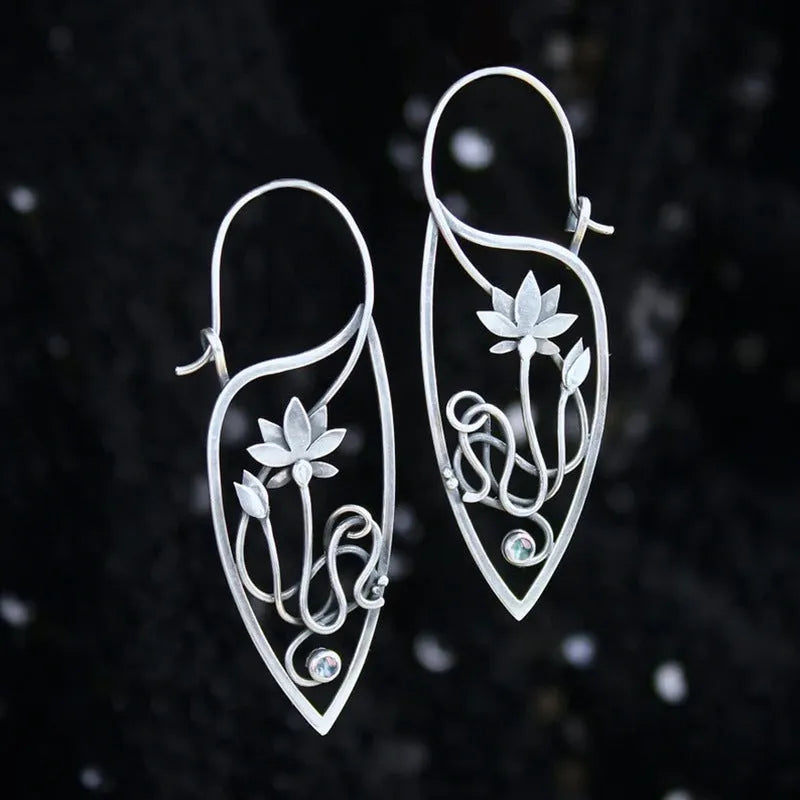 Silver lotus vine and geometric flower design earrings with rhinestone decoration on alloy base