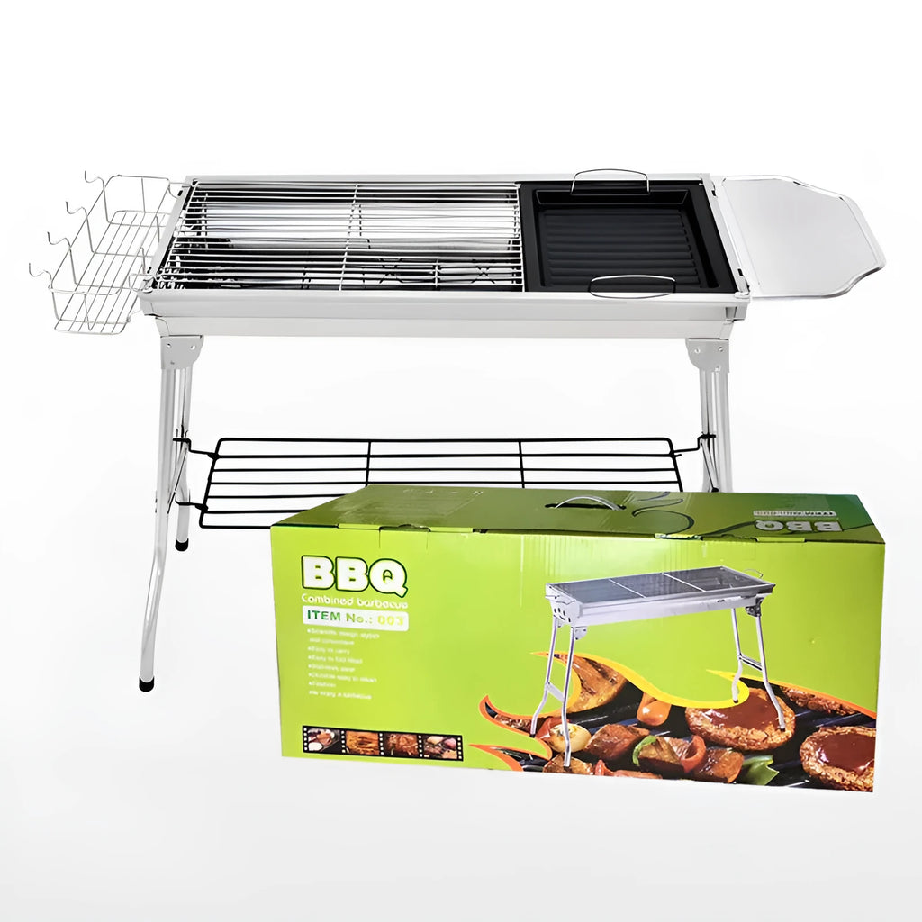 Stainless steel portable folding barbecue grill oven set up outdoors.