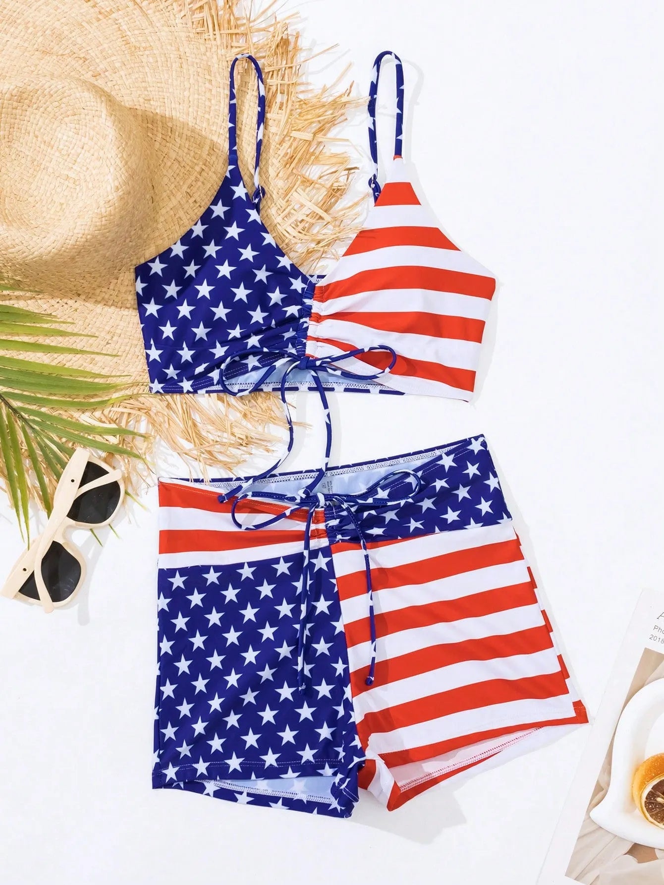 Women's blue and red stars and stripes high-waist swimsuit with a white drawstring waistband