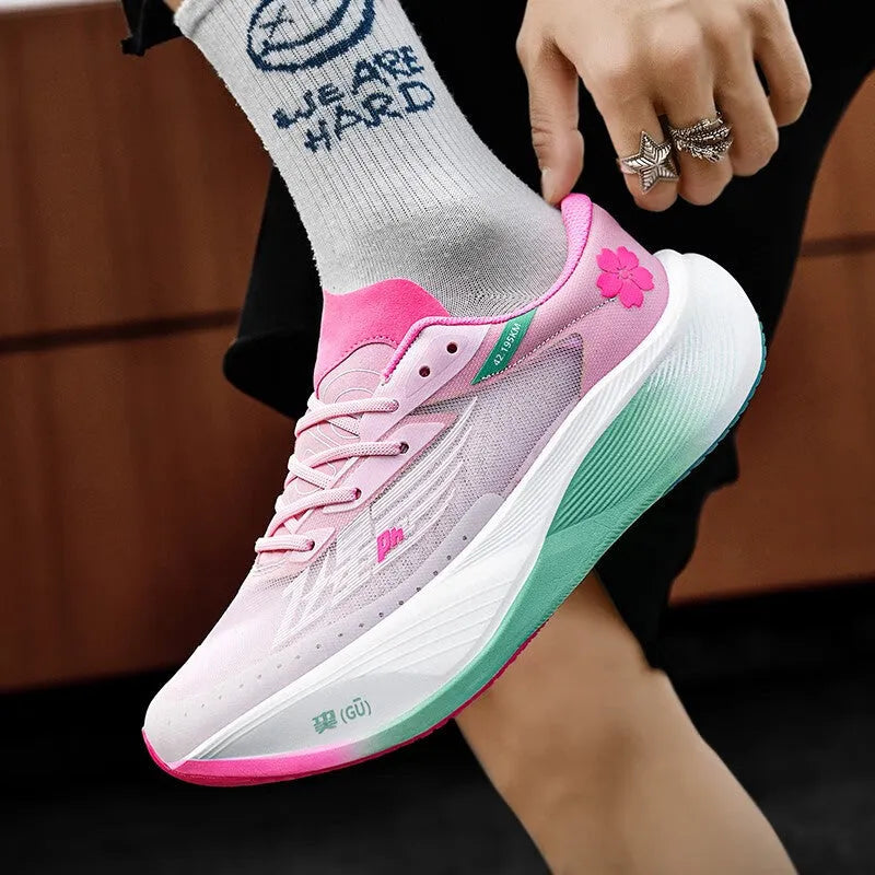 Low-top racing sneaker with carbon plate technology in Glacier colour, showing natural rubber sole and lace-up front.