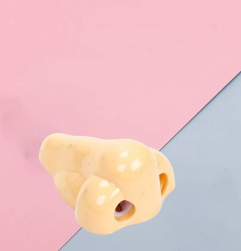 Flesh colour geometric plastic pencil sharpener with big nostril design measuring 58x45x30mm