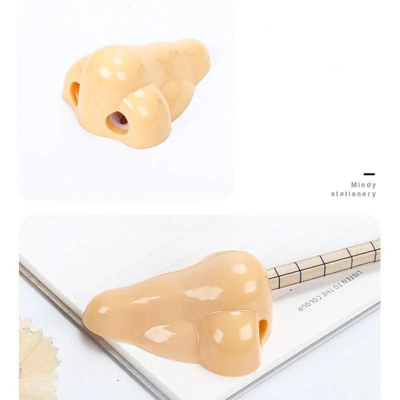 Flesh colour geometric plastic pencil sharpener with big nostril design measuring 58x45x30mm