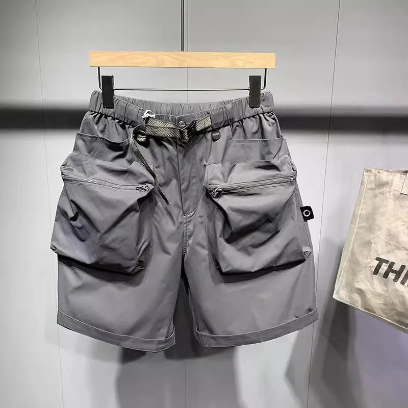 Men's loose fit workwear shorts in black or grey with pockets and straight leg hem available in large sizes