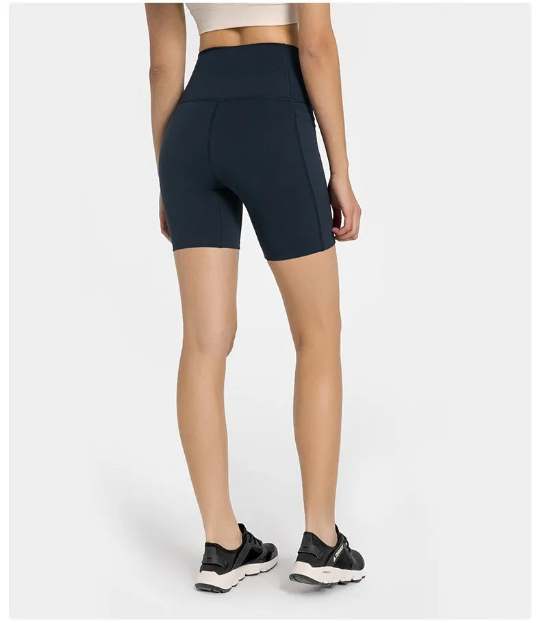 Woman wearing solid colour super stretch cotton blend sports shorts for running.