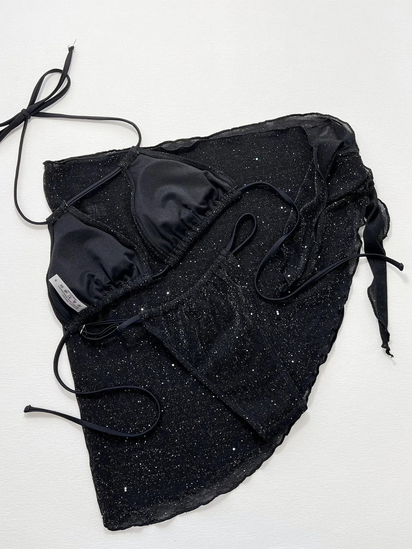 Black three piece bikini set with high waist shorts and top made of polyester fiber