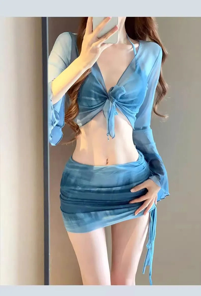 Women's blue high-waist bikini four-piece swimsuit set showing shirt, bra, underwear, and skirt components