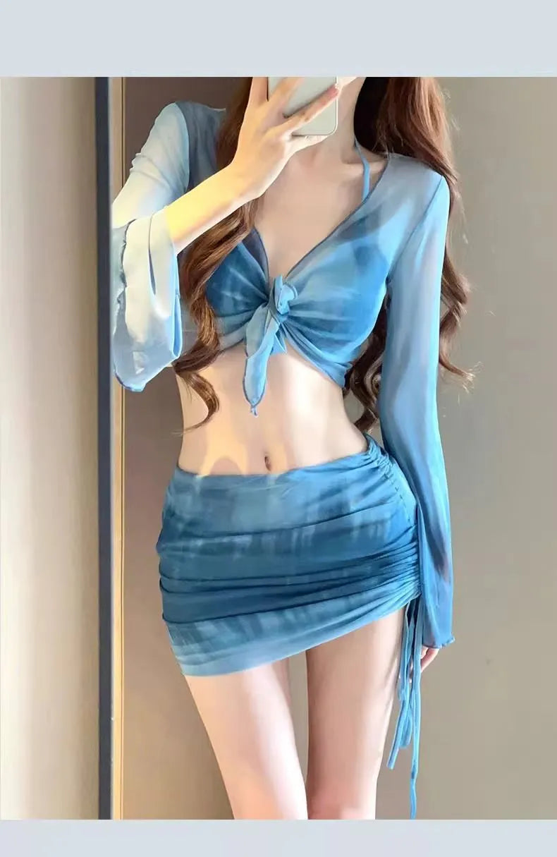 Women's blue high-waist bikini four-piece swimsuit set showing shirt, bra, underwear, and skirt components