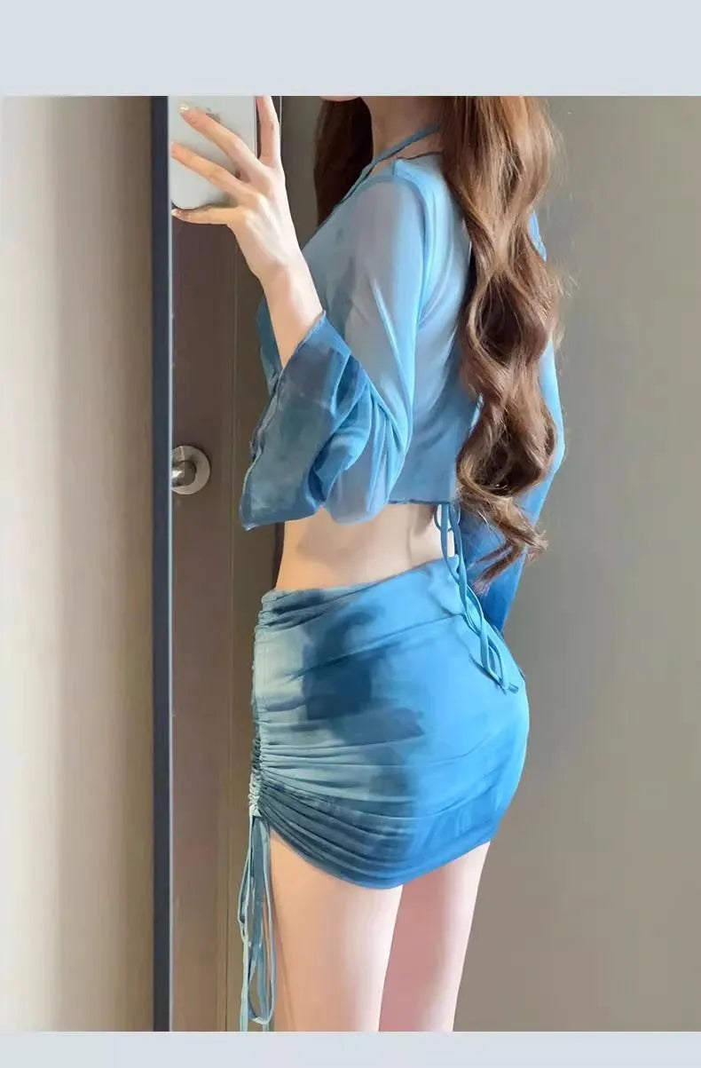 Women's blue high-waist bikini four-piece swimsuit set showing shirt, bra, underwear, and skirt components