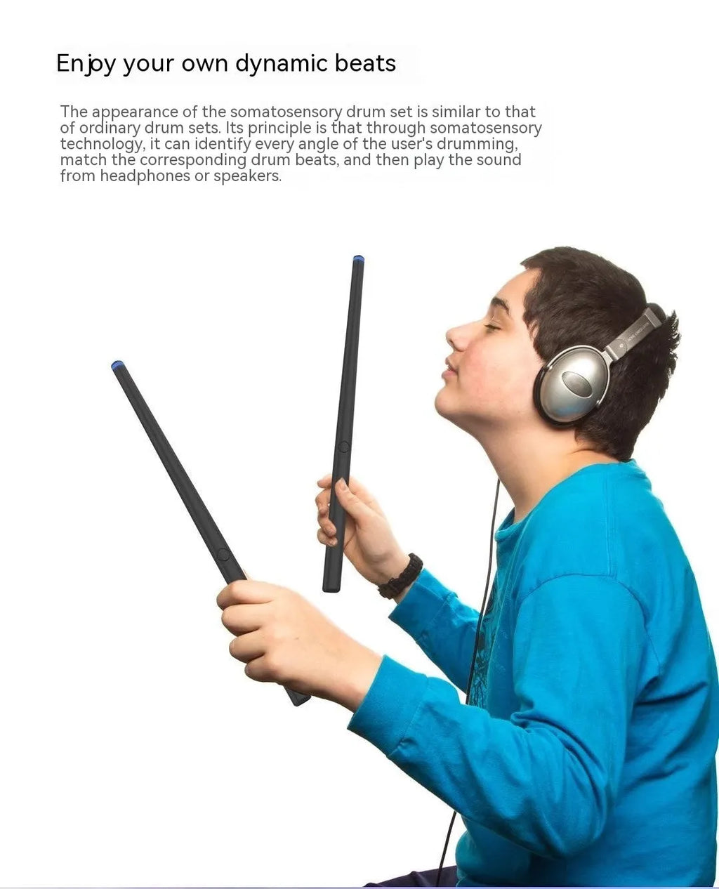 Black wireless somatosensory air drum kit host unit with drumsticks on a table.