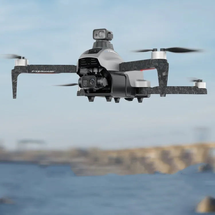 White F13 folding quadcopter drone with camera gimbal, obstacle sensors, and remote controller on a table.