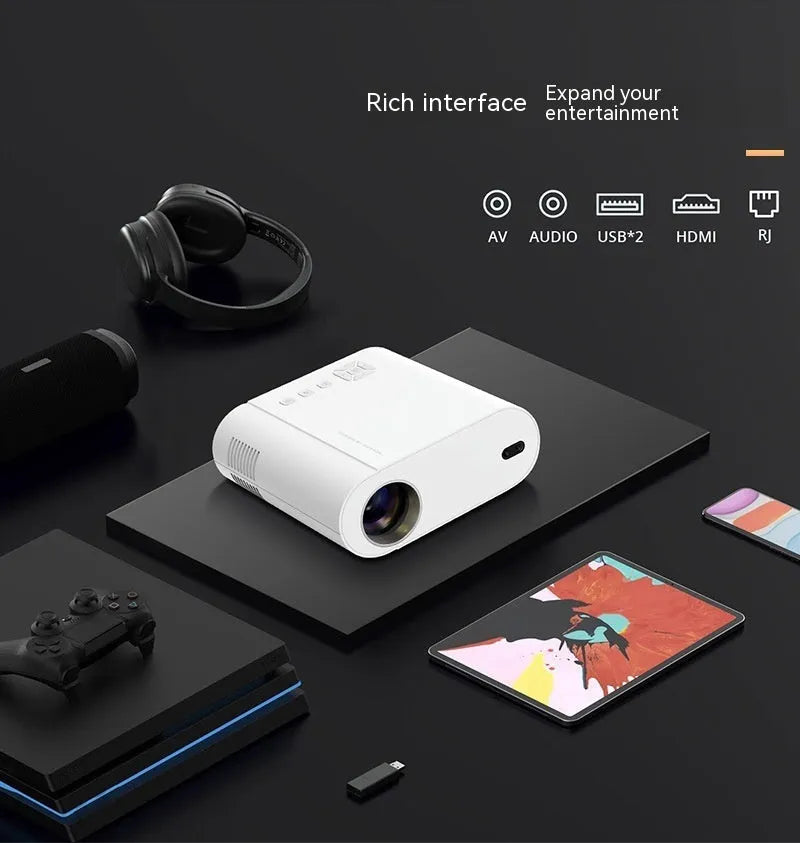 White Full HD smart projector with remote control on a table