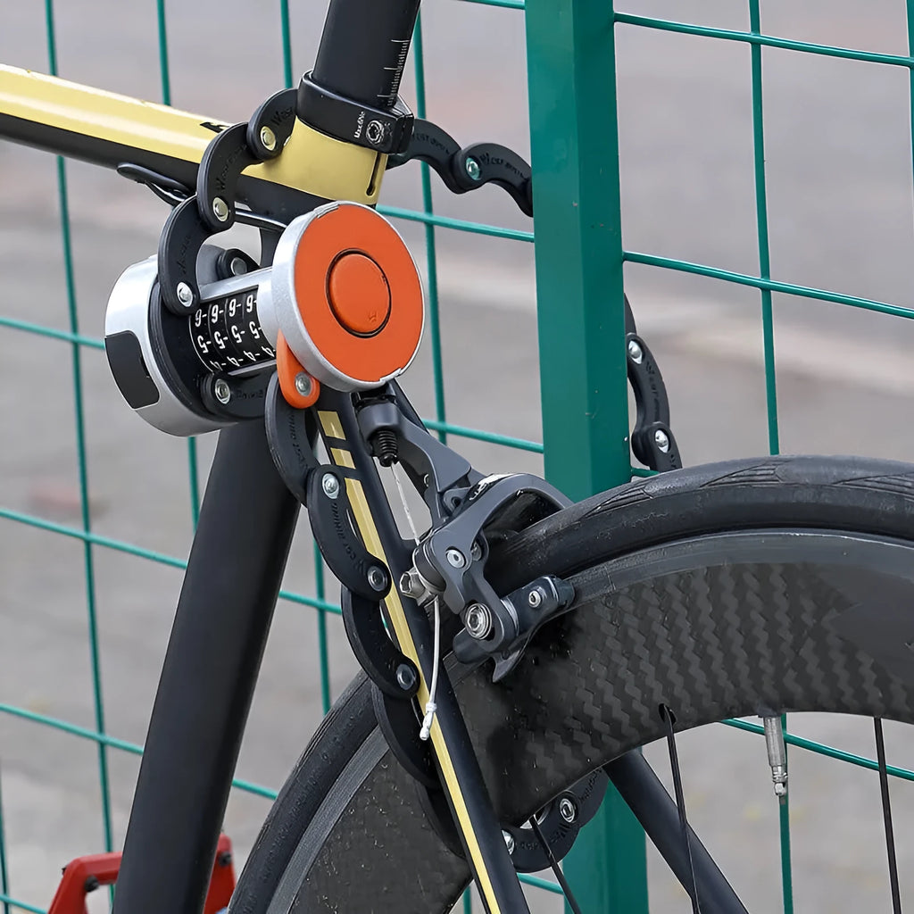 Black folding bicycle lock in compact storage position showing zinc alloy and steel construction