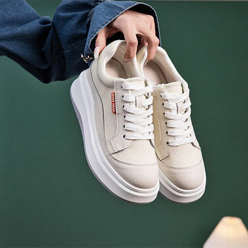 Women's beige leather casual shoes with thick flat soles showing side profile