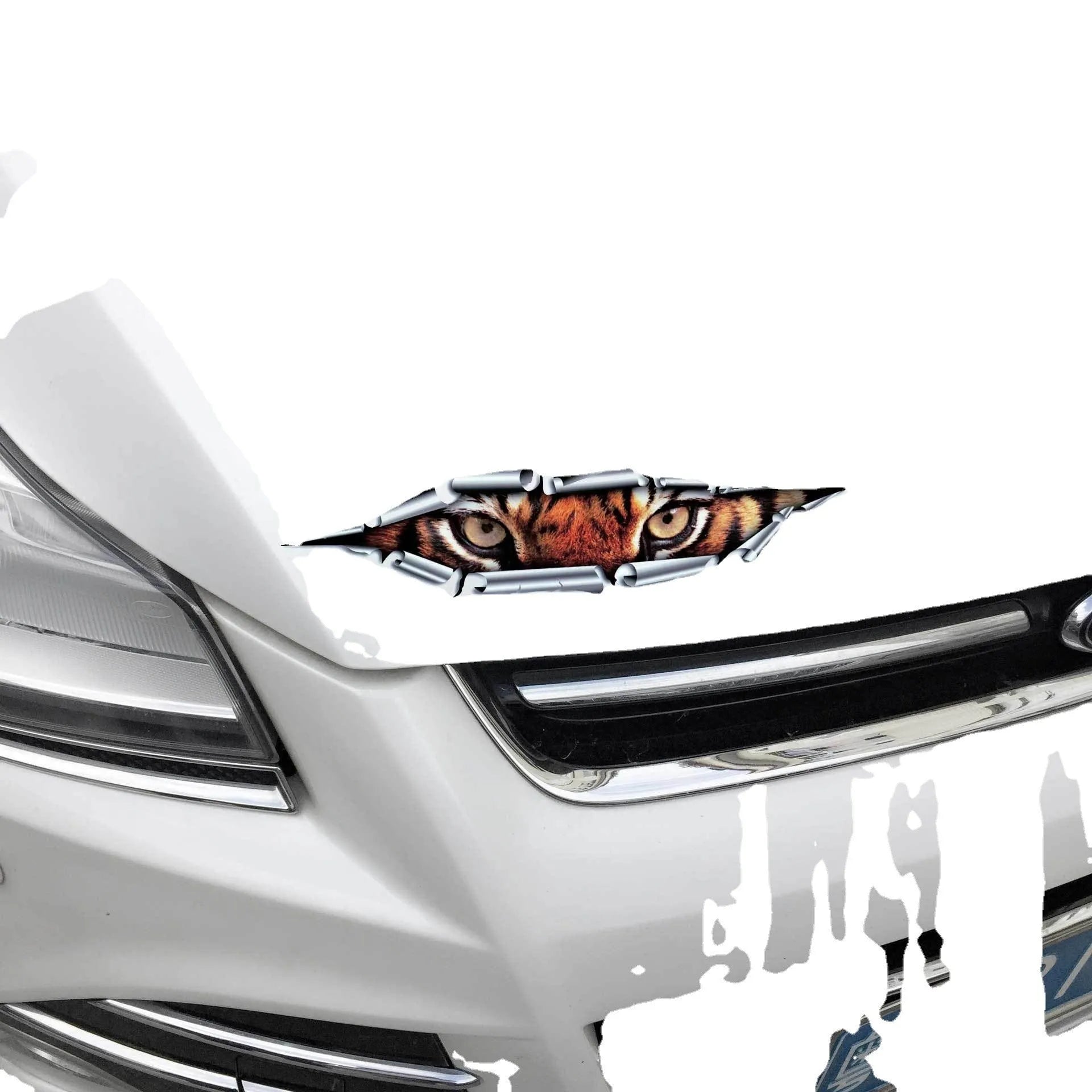 Close-up of a 3D transparent tiger eye car bumper sticker on a vehicle door.