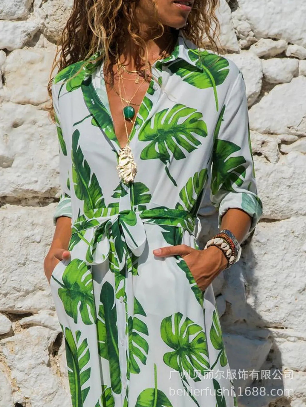 V-neck chiffon dress with printed pattern and A-line skirt on a hanger.