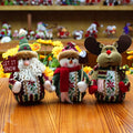 Red, green and white flannel fabric Christmas snowman decoration measuring 18cm by 13cm.