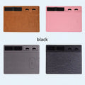 Pink wireless charging mouse pad with integrated mobile phone holder on a wooden desk