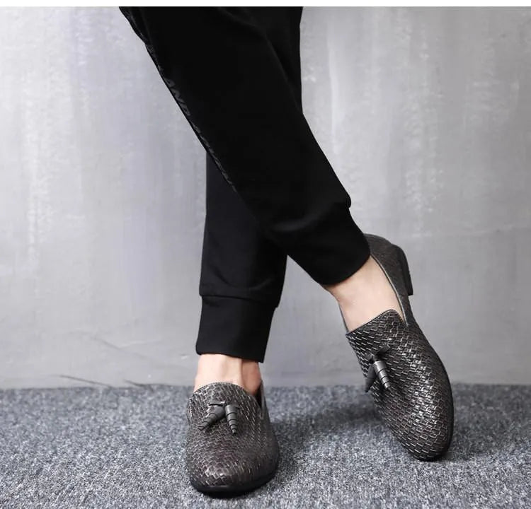Anyaman men's woven loafers in black with soft sole, side view showing handcrafted weave texture
