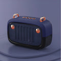 Compact portable mini Bluetooth subwoofer speaker in black, blue, green, grey, or orange, showing USB port and control buttons.