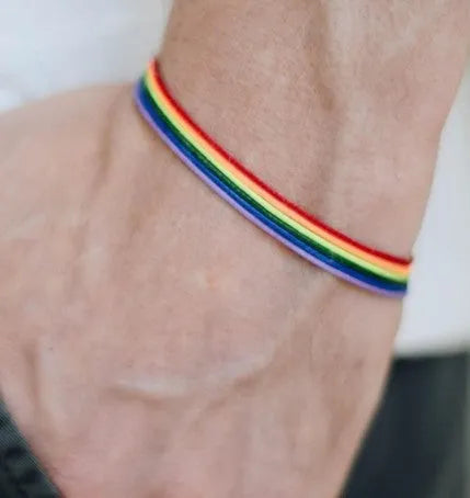 Rainbow pride bracelet with six braided wax cotton cords and silver-toned lobster claw clasp, unisex one size