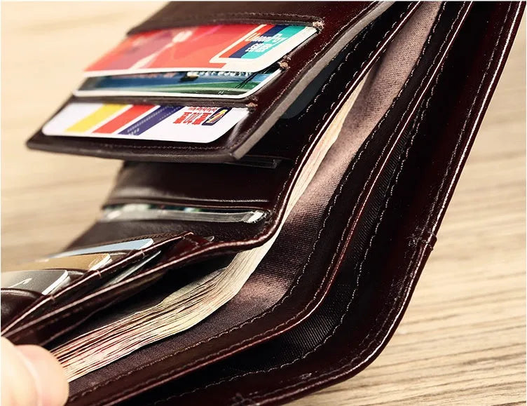 Men's leather wallet showing multiple internal compartments including photo position, card slots and banknote folder