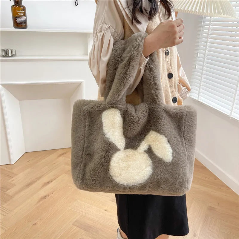 Cartoon rabbit ears design on a solid colour plush tote bag for women.