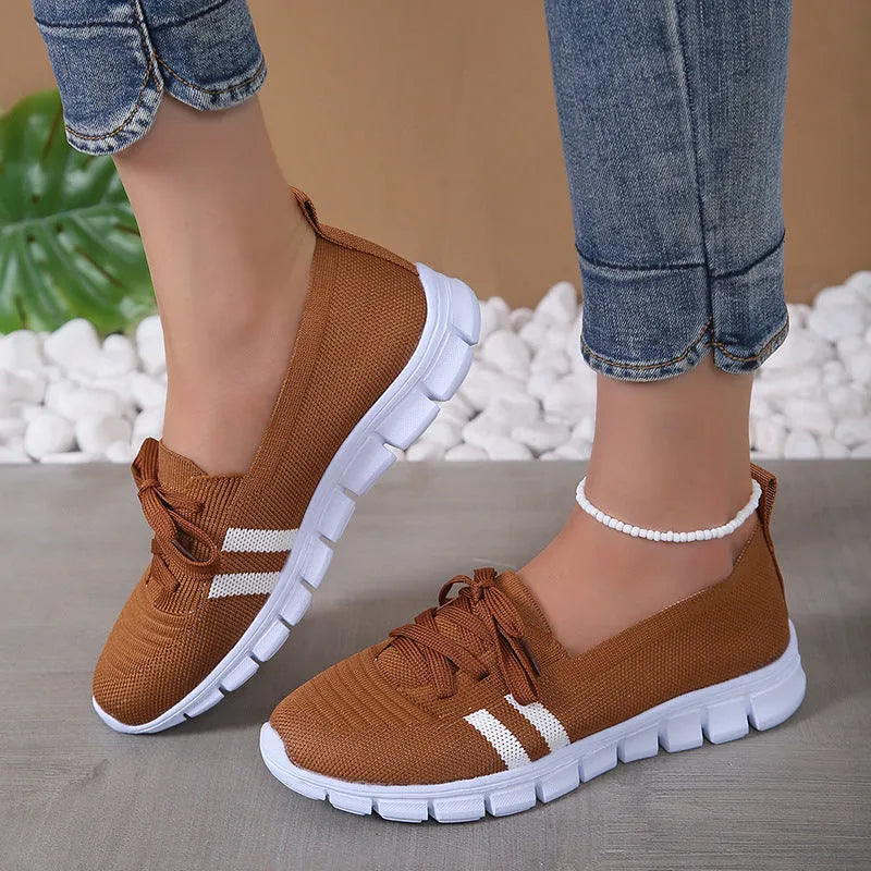 Women's lace-up mesh trainers with flat rubber sole, round toe and shallow mouth, shown in grey, black, orange and brown