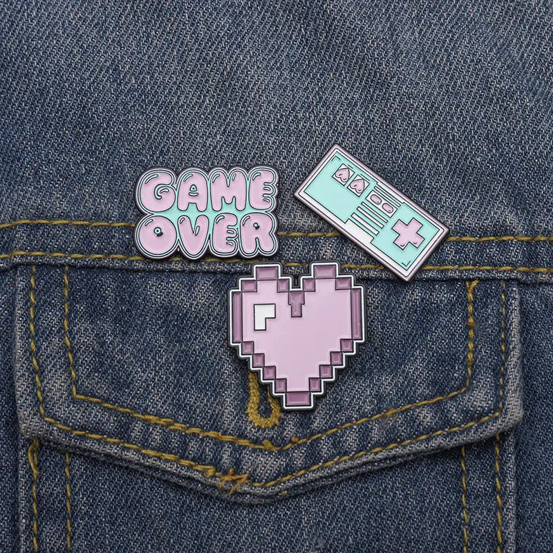 Stereo game console badge made from alloy metal in one of three colour options