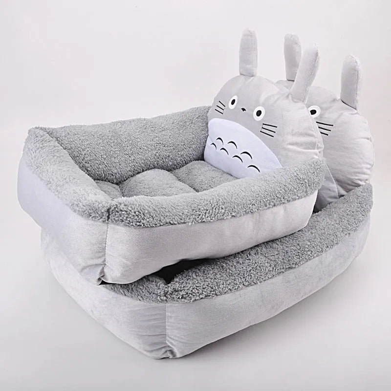 Cartoon print washable pet sofa bed for a small dog or cat, shown in blue, brown, gray, pink, or yellow.
