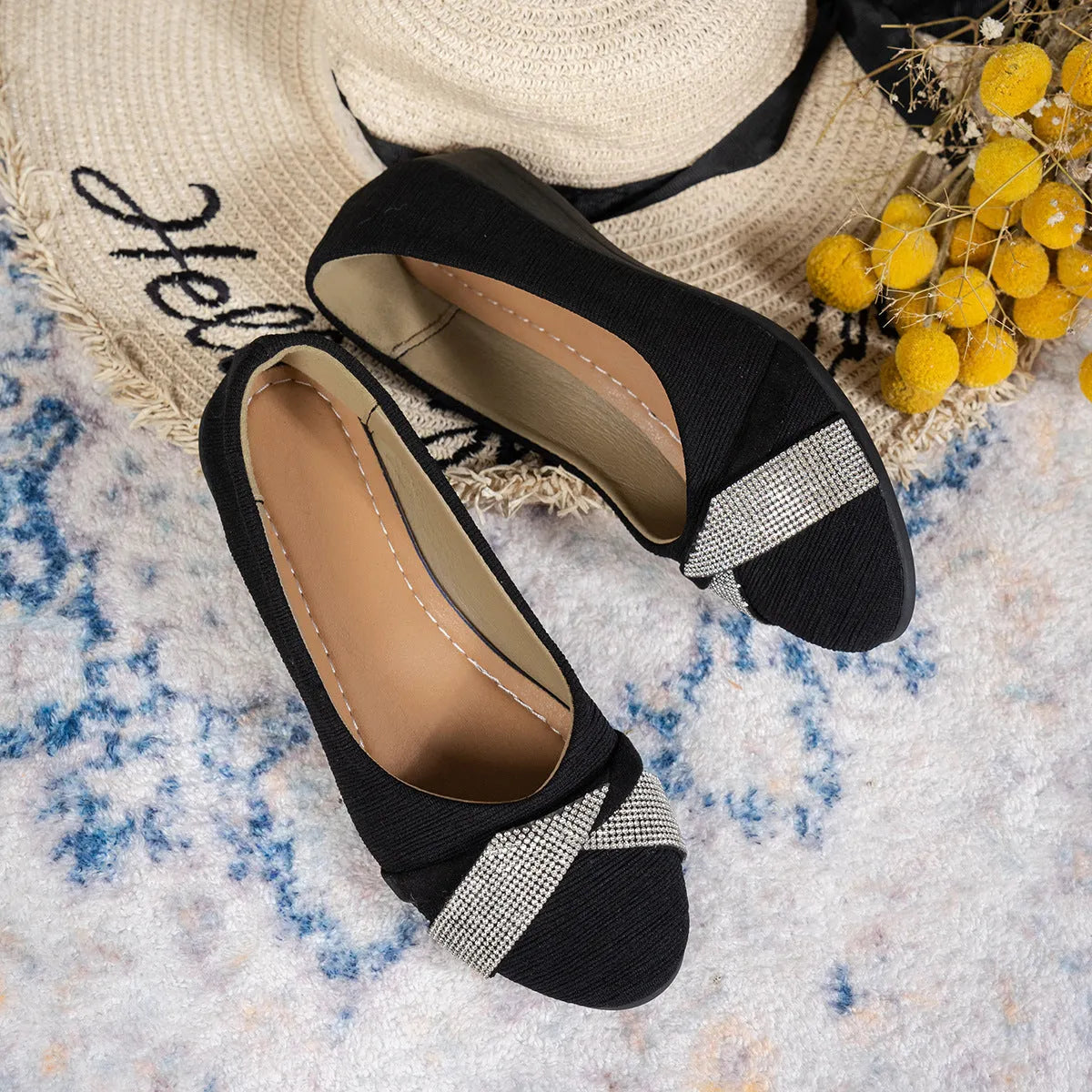 Black women's slip-on casual shoes with rhinestones on fabric upper and a chunky heel.