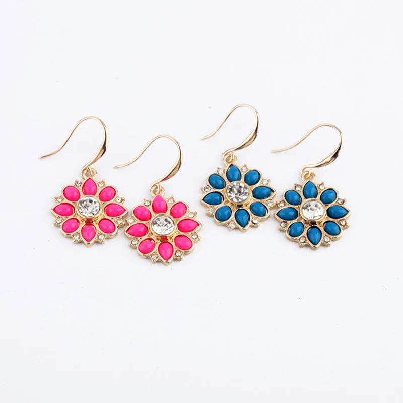 Pair of alloy flower-shaped earrings with artificial gemstone inlay, available in blue or red for women