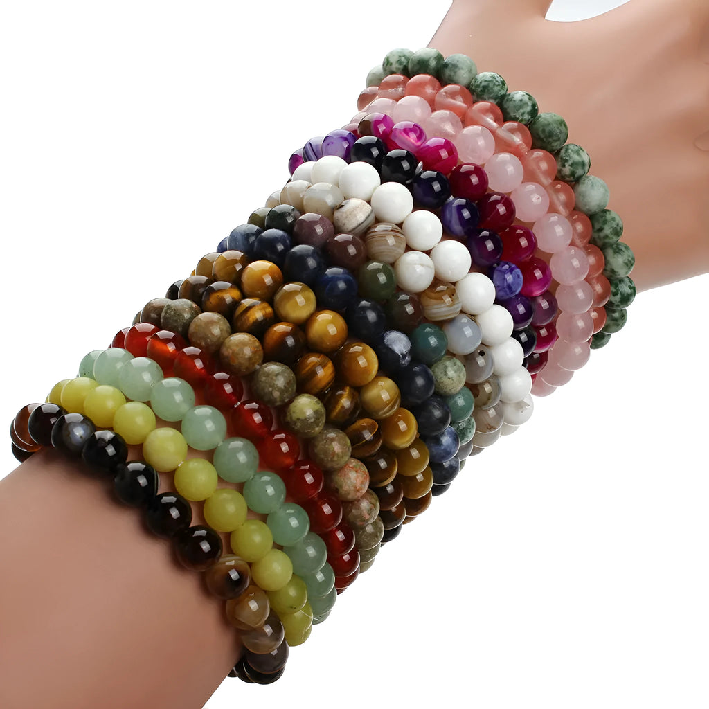 Natural stone round bead bracelet in aventurine blue sandstone with geometric design on white background