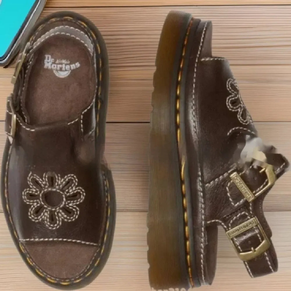 Men's black embroidered floral pattern beach sandals with flat heel on a neutral background