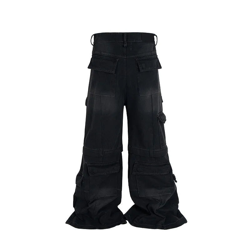 Black washed-out cotton detachable overalls with multiple pockets on a hanger.