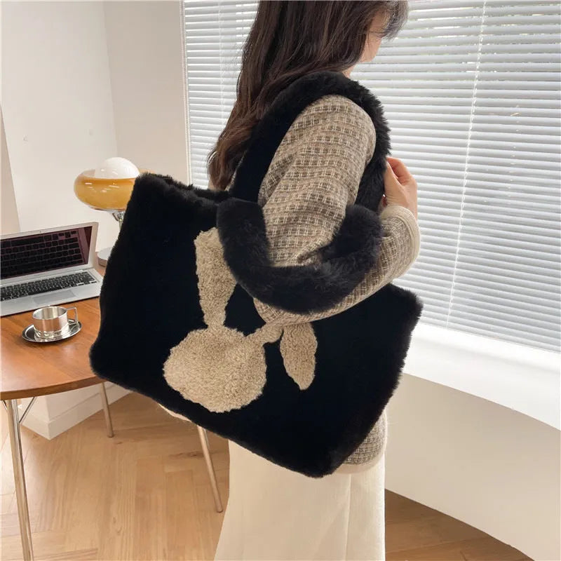 Cartoon rabbit ears design on a solid colour plush tote bag for women.