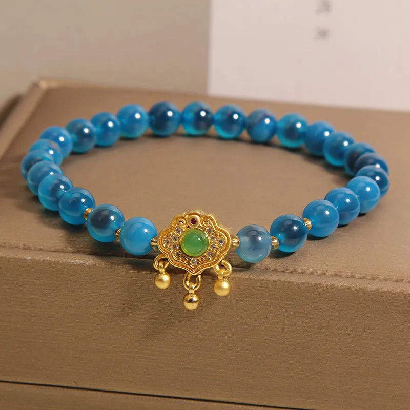 Blue sugar heart agate safety lock pendant bracelet for women with crystal construction and rhinestone detailing