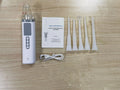 Milky white plastic tonsil stone extractor oral cleaning tool on a white background.