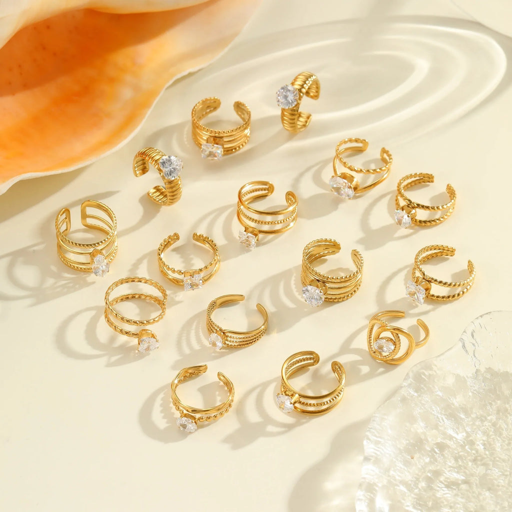 Gold plated stainless steel geometric heart ring with zircon stones and adjustable open mouth design.